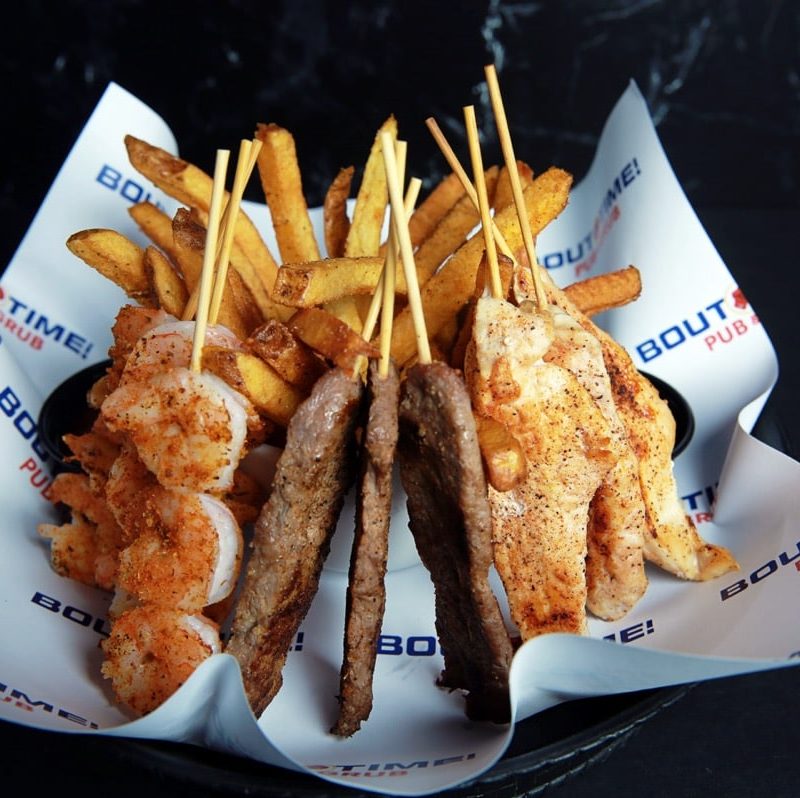 Shareable combo of three of each: beef, chicken and shrimp skewers prepared grilled or battered and fried. Served on a bed of french fries. Solo Shot available too (3 skewers of the same protein).