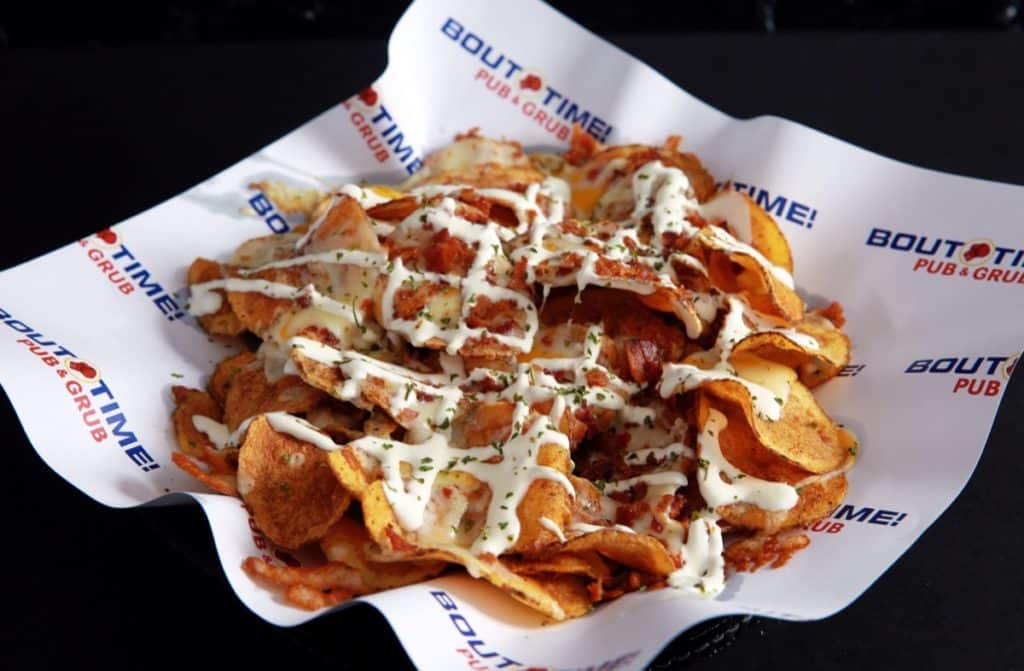 Deep fried potato slices perfectly seasoned and smothered with ranch dressing, shredded cheese and crumbled bacon. Topped with sour cream and parsley.