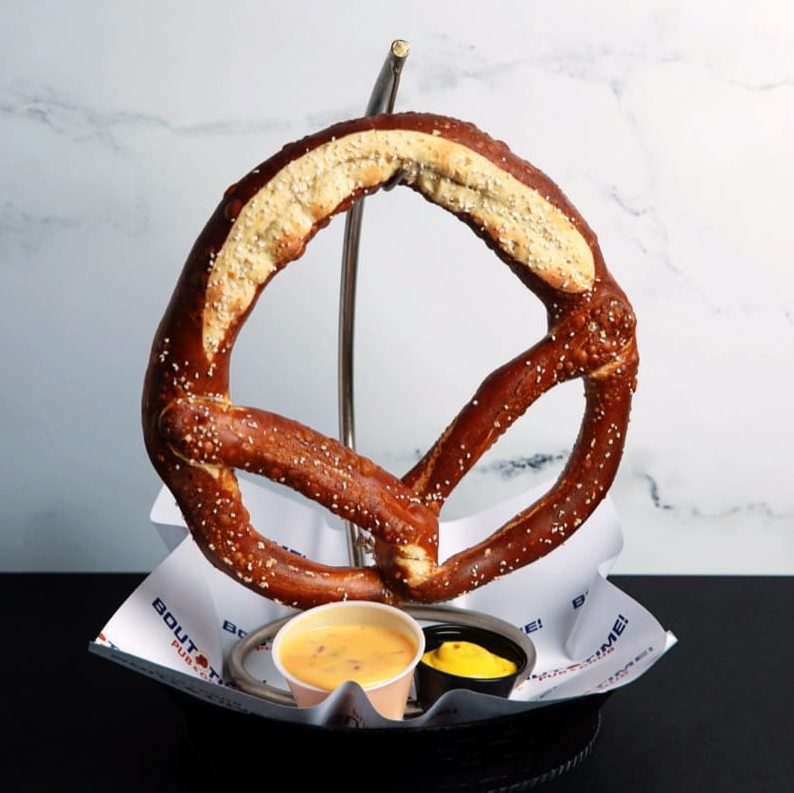 A fresh baked jumbo pretzel. Served with queso & mustard for dipping.