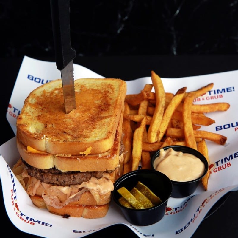 A ground chuck patty, sandwiched between two Parmesan cheese crusted grilled cheese sandwiches. Served with grilled onions and 1000 island dressing.