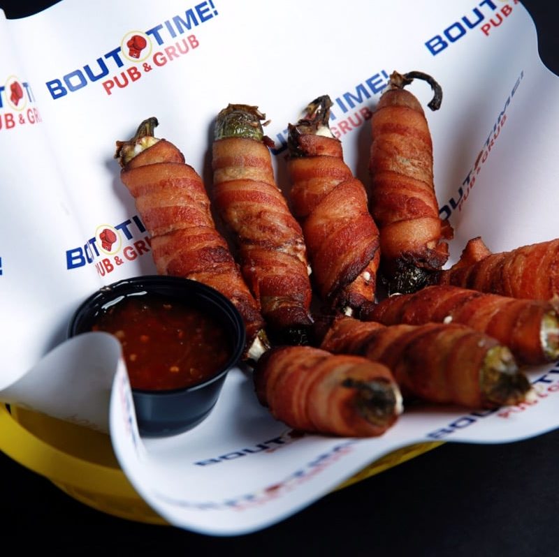Fresh jalapenos stuffed with cream cheese and wrapped in bacon. Dipping sauce on the side.